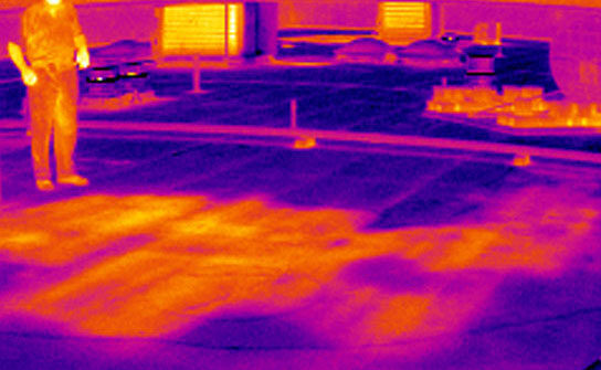 Infrared image showing on-roof moisture survey for school system